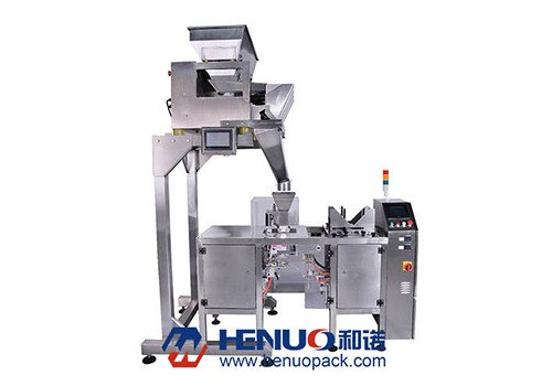 Упаковочная машина HNDG-K300-4T с четырехголовочным весовым устройством под дой паки. 